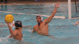 A freshman water polo player scored goal in 4th quarter of the game.